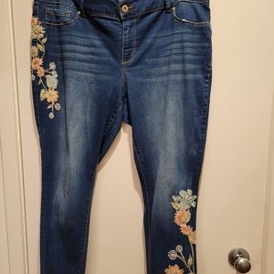 Jessica Simpson distressed embroidered faded blue denim skinny fit jeans.